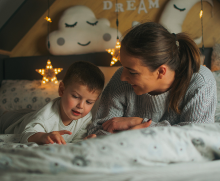 woman and her child reading a bedtime story